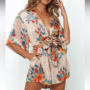 Floral romper with pockets - still in bag, never been worn with tags